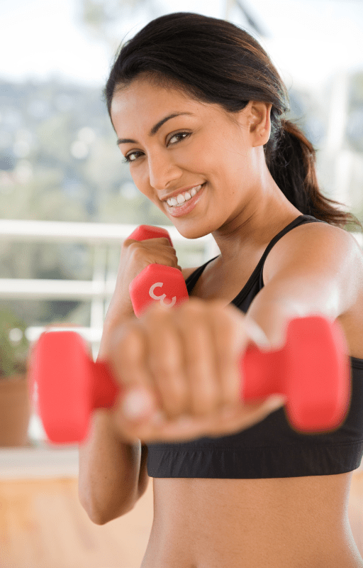 A girl exercising with weights